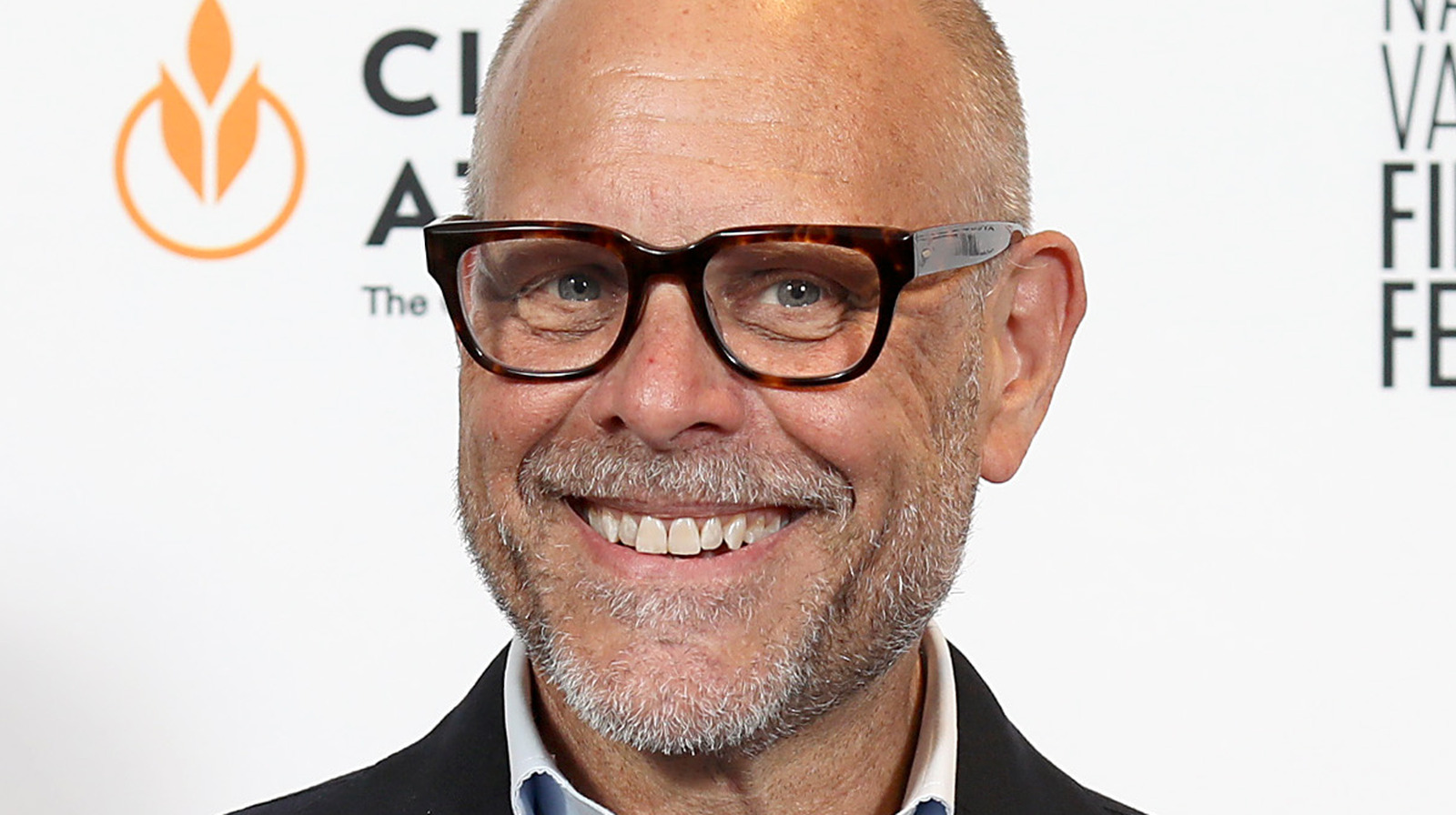 The Controversial Way Alton Brown Drinks Red Wine