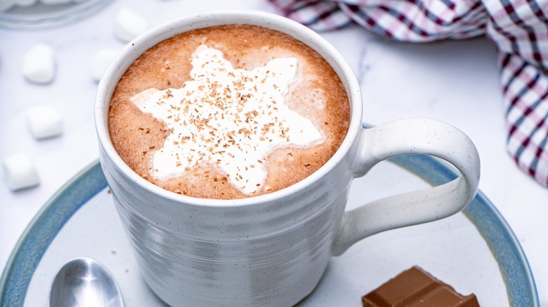 Hot chocolate with snowflake shaped whipped cream
