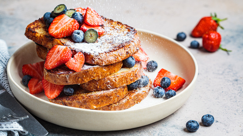 French toast with powdered sugar, berries