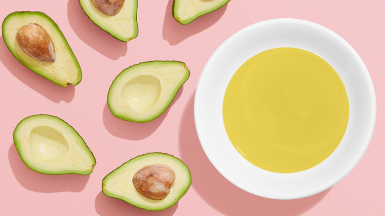 avocados and bowl of oil