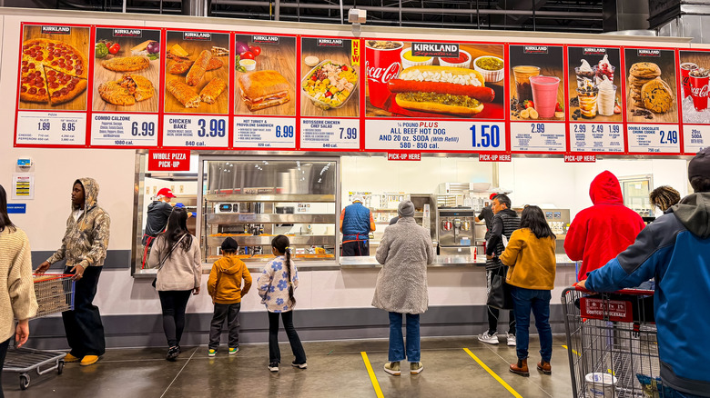 Customers waiting in line at a Costco food court