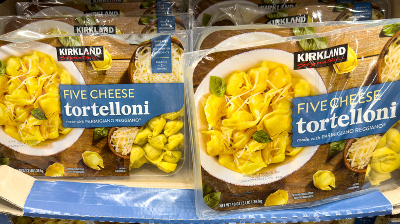 Packages of Kirkland Signature Five Cheese Tortelloni on a warehouse shelf