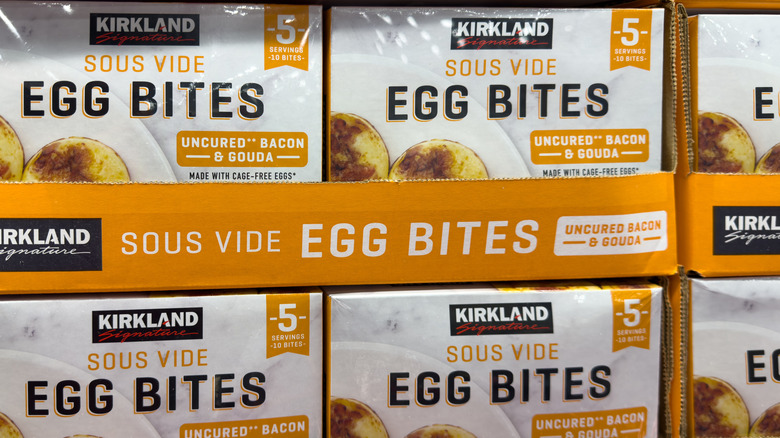 Boxes of Kirkland Signature Uncured Bacon and Gouda Egg Bites on a store shelf