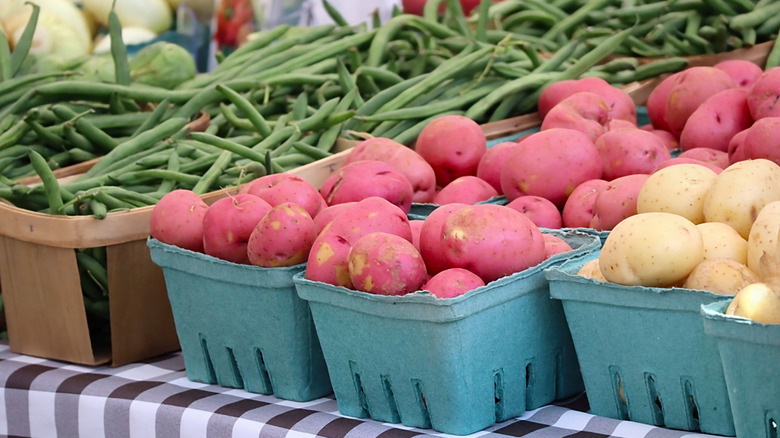 Green beans and potatoes displayed at a farmer's market