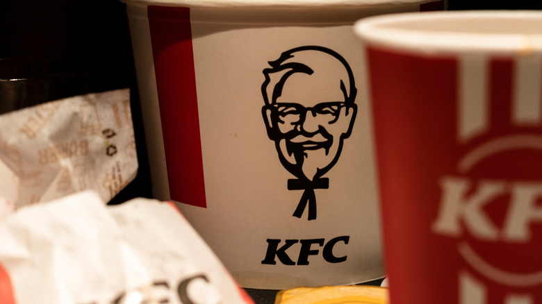 KFC buckets with soda cups.