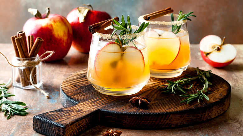 Two apple cider margaritas with cinnamon and rosemary