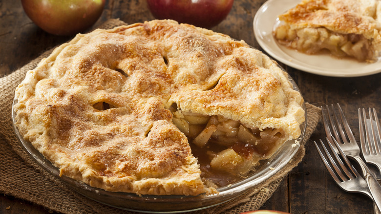 fresh baked apple pie with slice cut