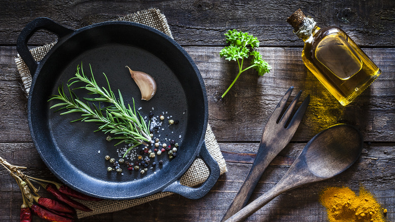 cast iron pan with herbs and spices