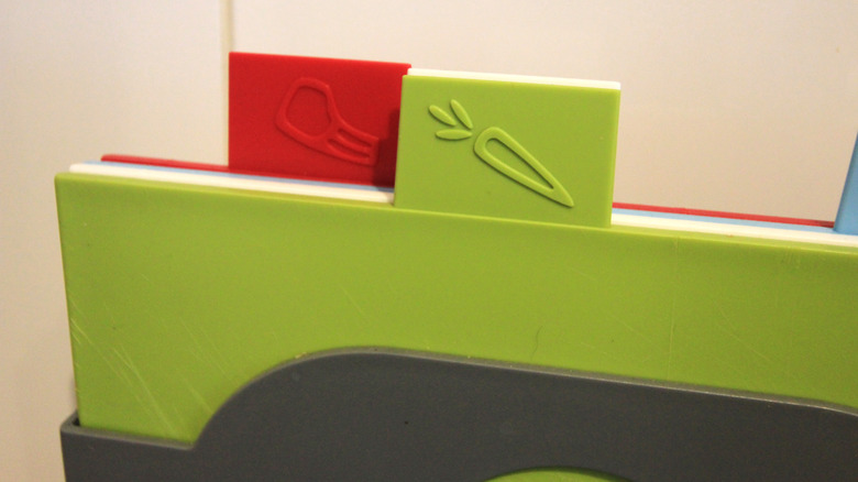 Color-coded cutting boards in kitchen