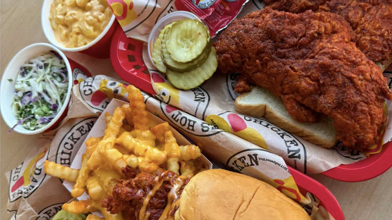 Dave's Hot Chicken meals with fries, coleslaw and pickles