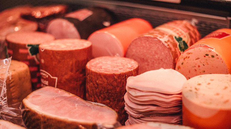 Bologna, ham, and other deli meats in grocery deli counter