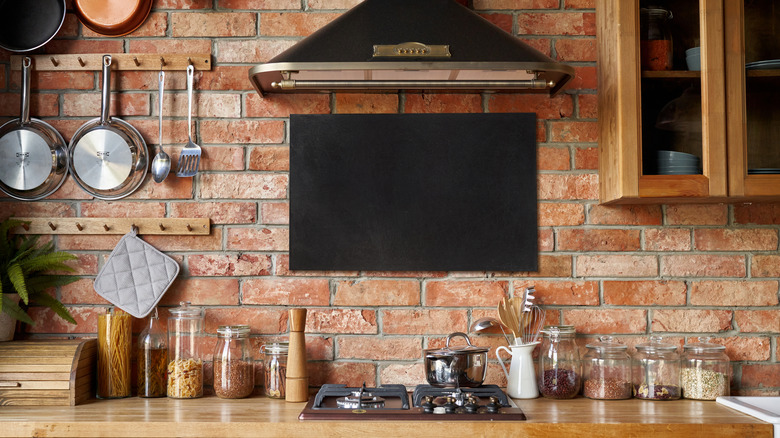 Kitchen with brick wall, wooden counters