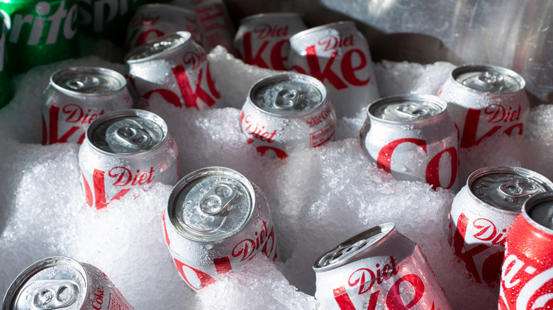 Cans of Diet Coke sitting in crushed ice