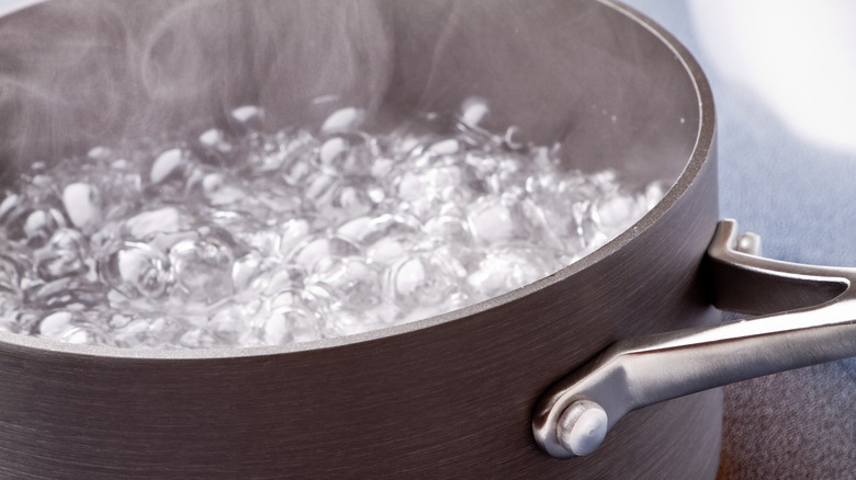 Close-up of water boiling in pot