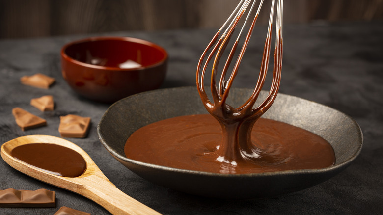 bowl of chocolate sauce with whisk