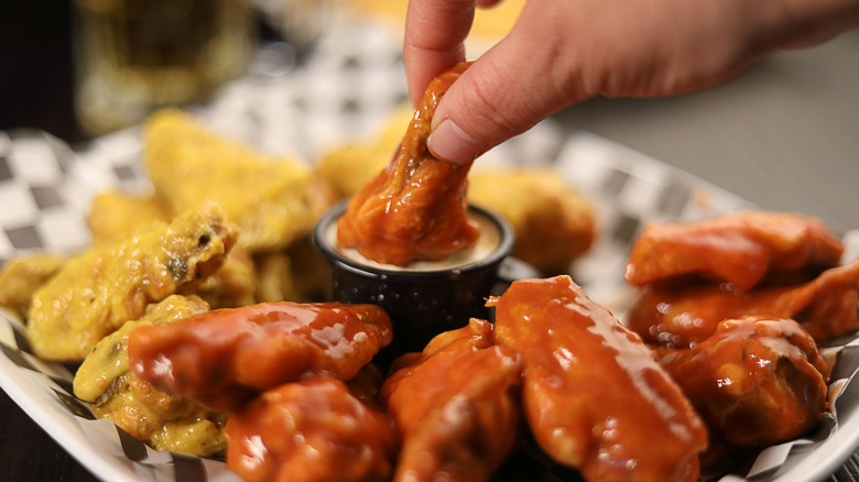 Party wing dipped in sauce
