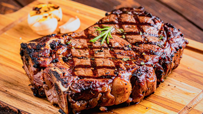 grilled ribeye steak on a cutting board