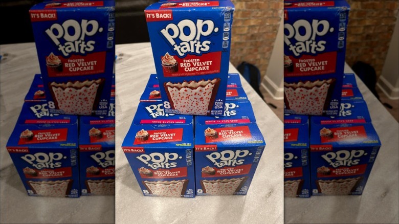 Frosted red velvet cupcake Pop-Tart boxes stacked on countertop