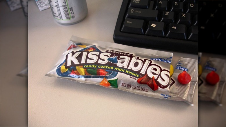 Hershey's kissables package next to computer