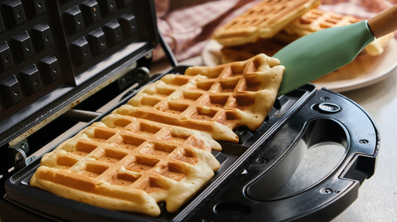 lifting waffles from a waffle maker