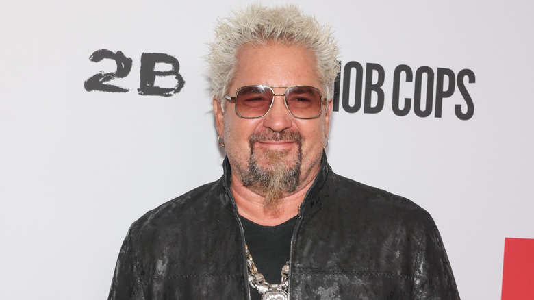 Guy Fieri smiles at an event