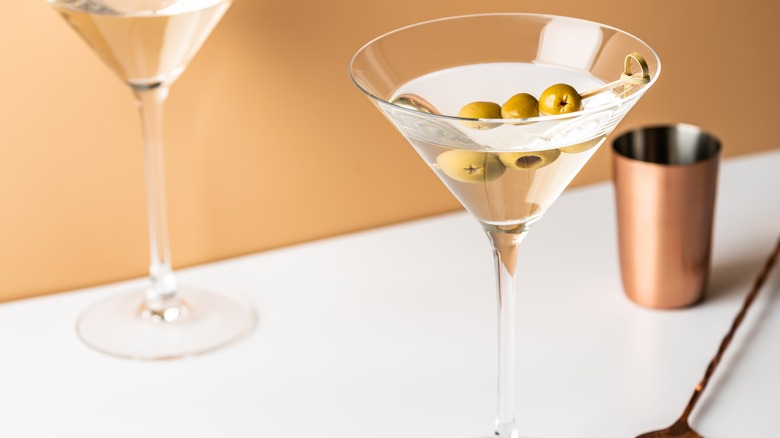 martini with olive and shaker