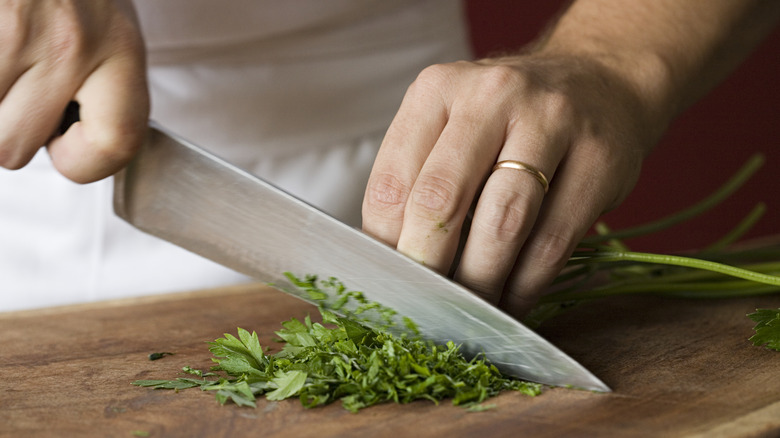 knife cutting herbs