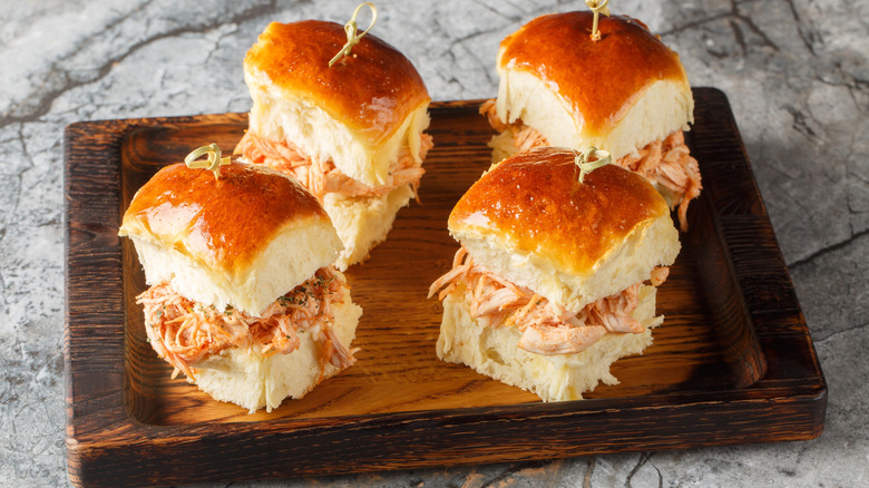 Chicken Parmesan sliders on a wooden plate