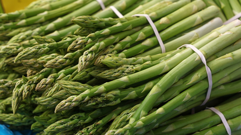 Close-up of several bunches of fresh asparagus