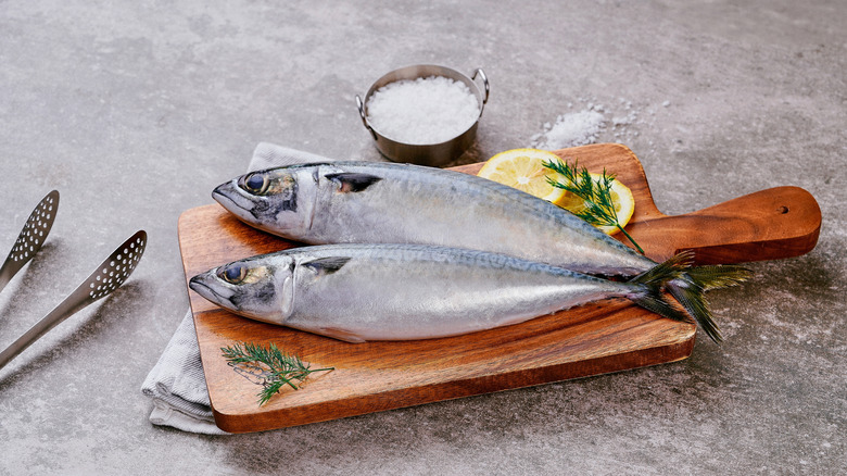 fish on board with lemon and salt for seasoning