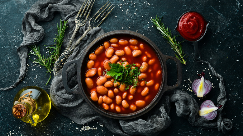 Small pot of beans in tomato sauce.