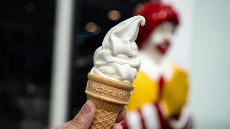 Person holding an ice cream cone at McDonald's