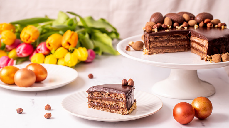 A layered chocolate cake with nuts