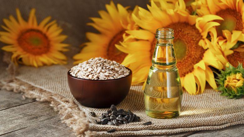 Burlap sacks with wooden scoops filled with seeds and grains