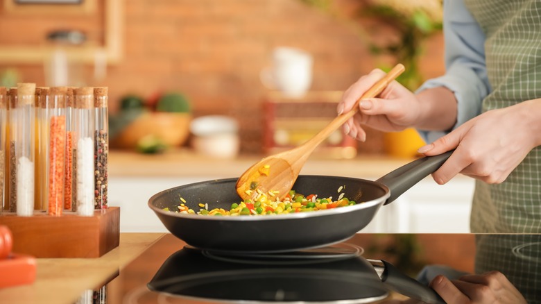 wok cooking on electric stove