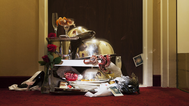 Dirty dishes from room service outside hotel room door