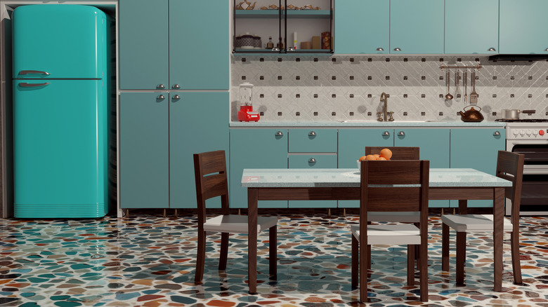 A 1960s style kitchen with a turquoise vintage refrigerator