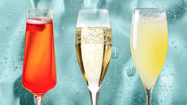 Three sparkling wine cocktails in flute glasses 