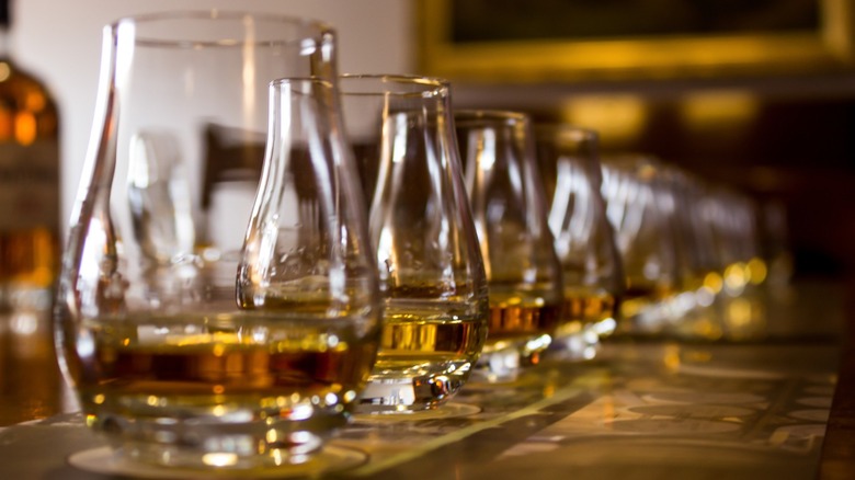 Whiskey in Glencairn glasses on bartop