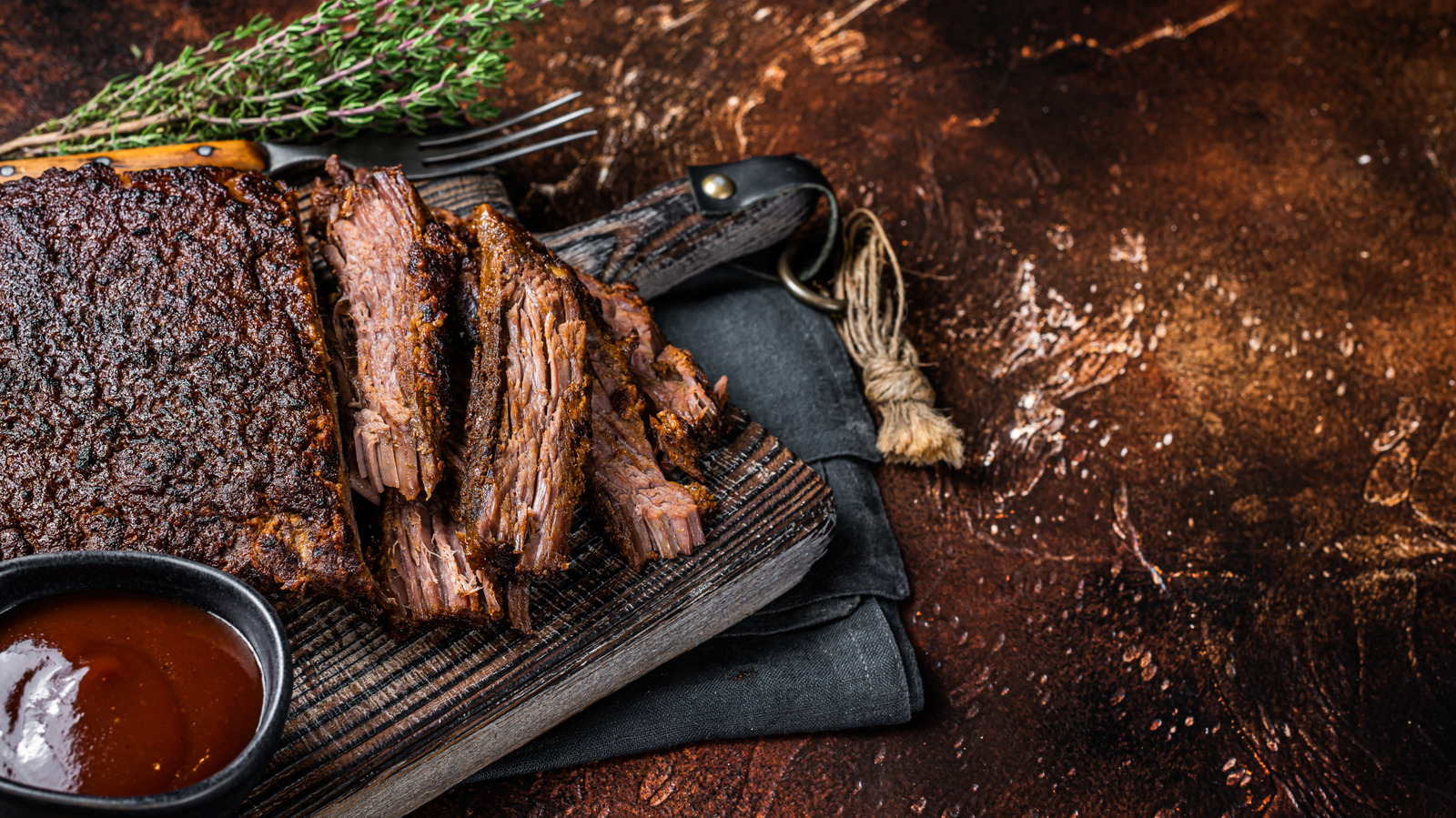The Expert Brisket Trick That Can Lock In All The Juicy Flavor While It Smokes