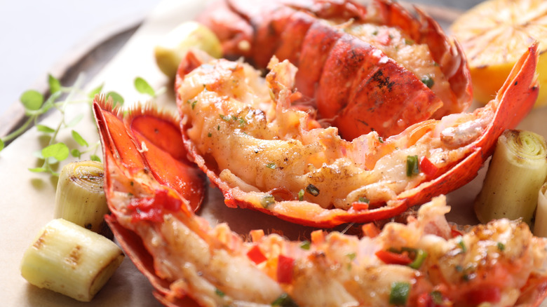 lobster tail with microgreen garnish on a plate
