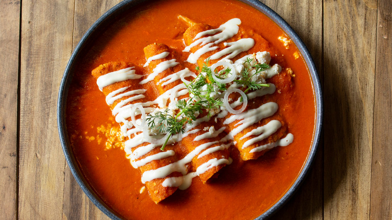 enchiladas doused in red sauce