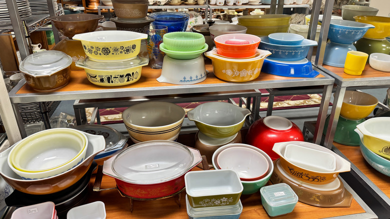 Vintage Pyrex dishes on a thrift store shelf