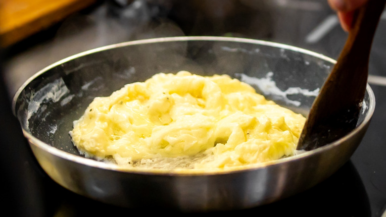 quick scrambled eggs in a pan on a stovetop