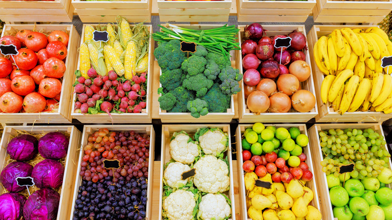 fruit and vegetables in wood boxes at farmers market