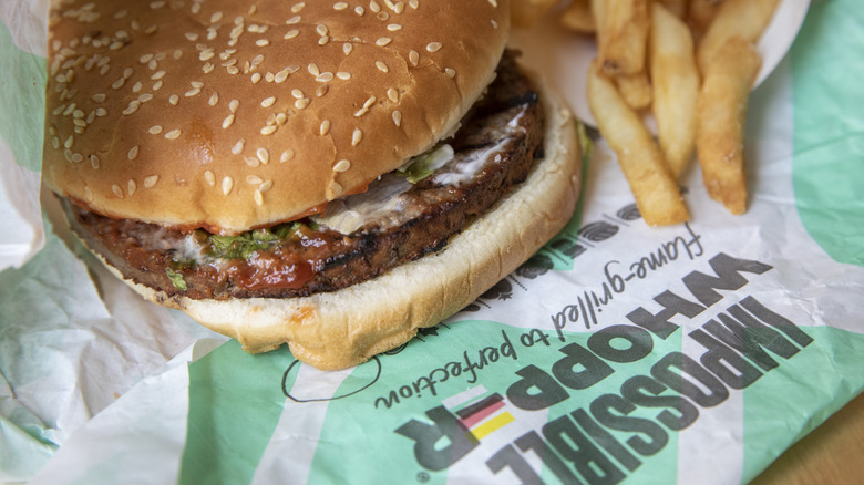 Impossible Whopper on wrapper with fries