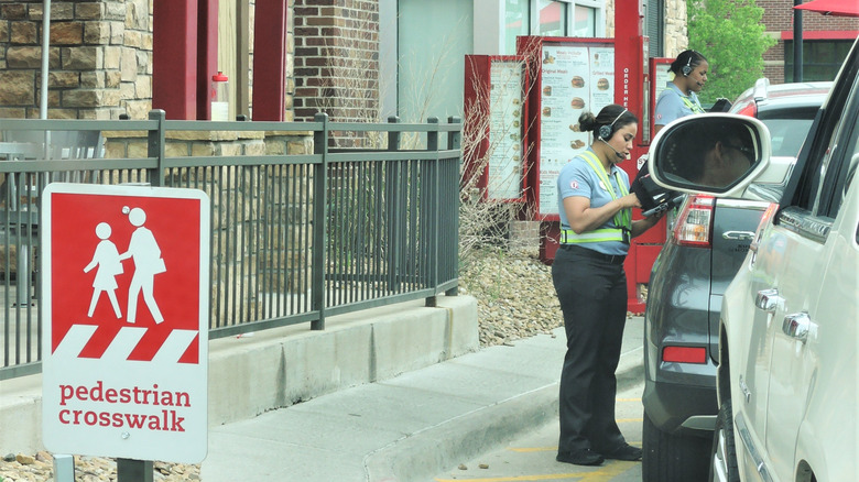 Chick Fil A employee comes outside to take order