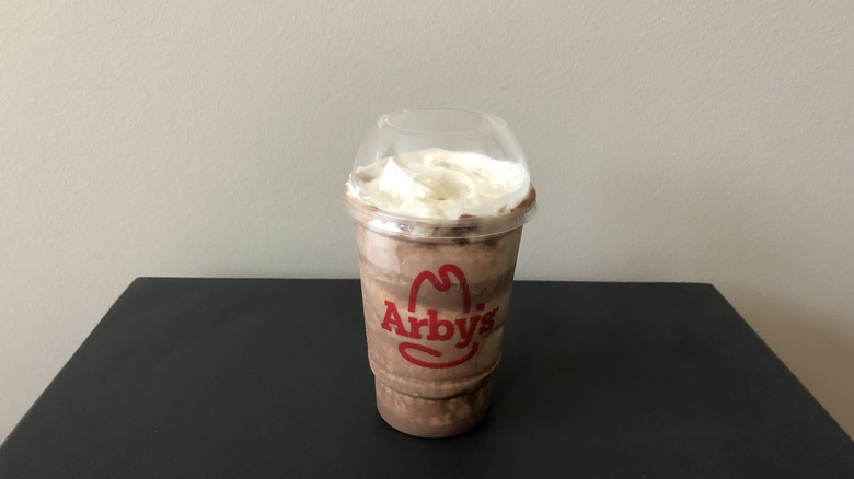 Arby's milkshake set on table