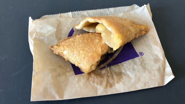 Taco Bell caramel apple empanada cut in halves