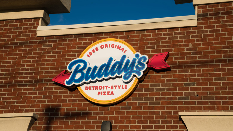 Buddy's Pizza sign on brick building